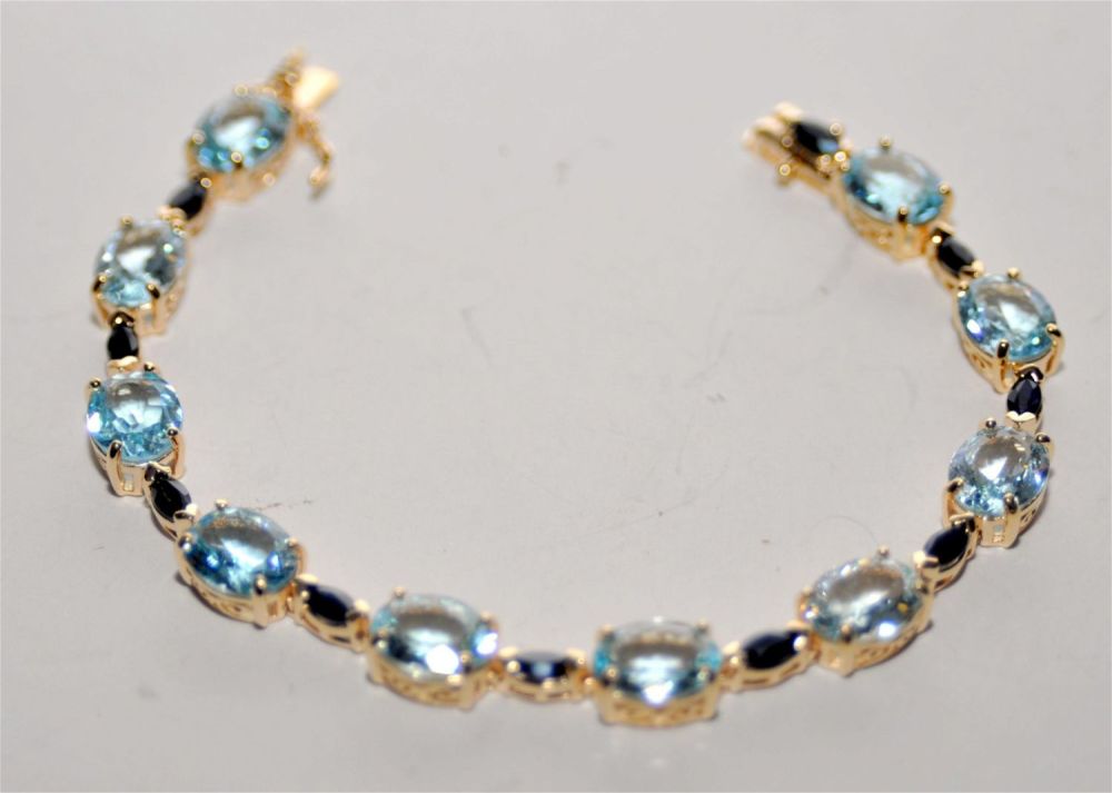 Lot 158: Vermeil blue topaz sapphire bracelet