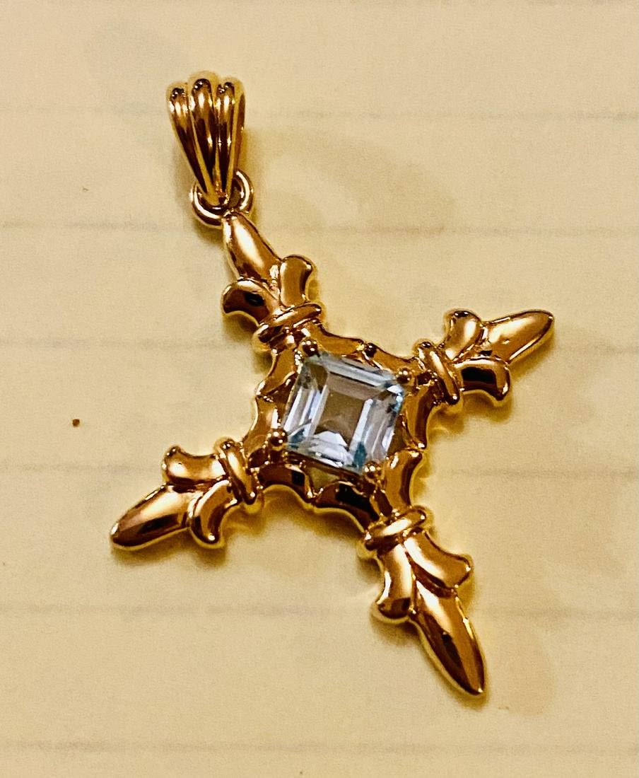 Lot 205: Vermeil cross blue topaz stone
