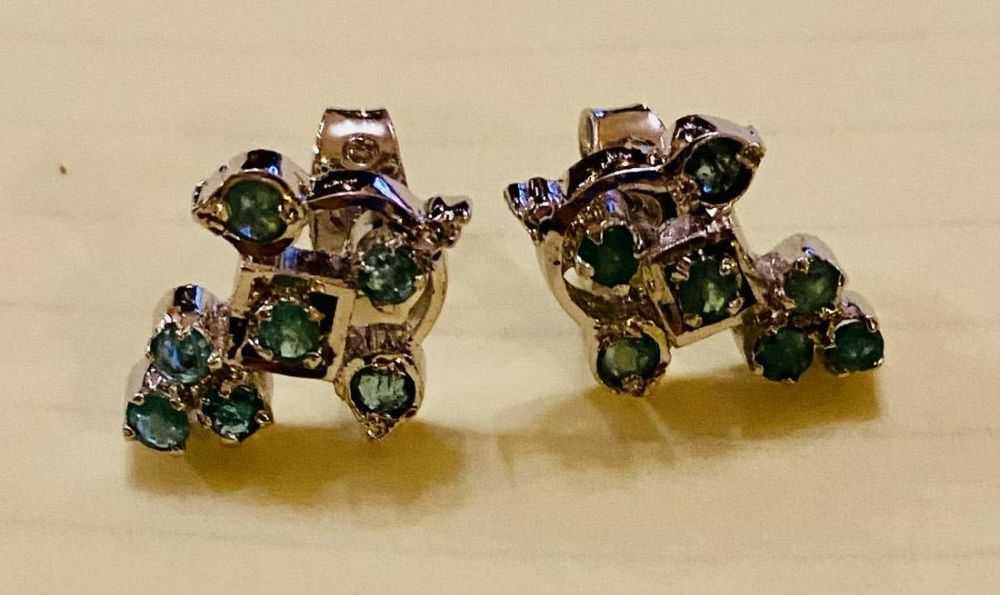 Lot 210: Emerald sterling earrings pierced