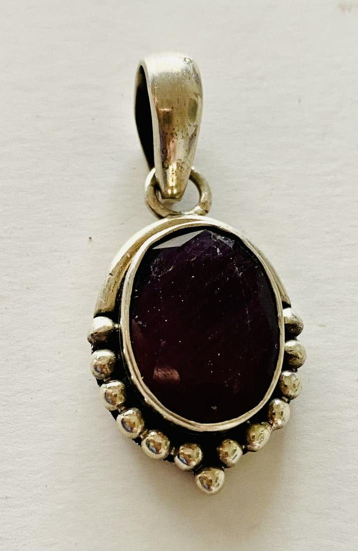 Lot 219: Sterling ruby pendant faceted.