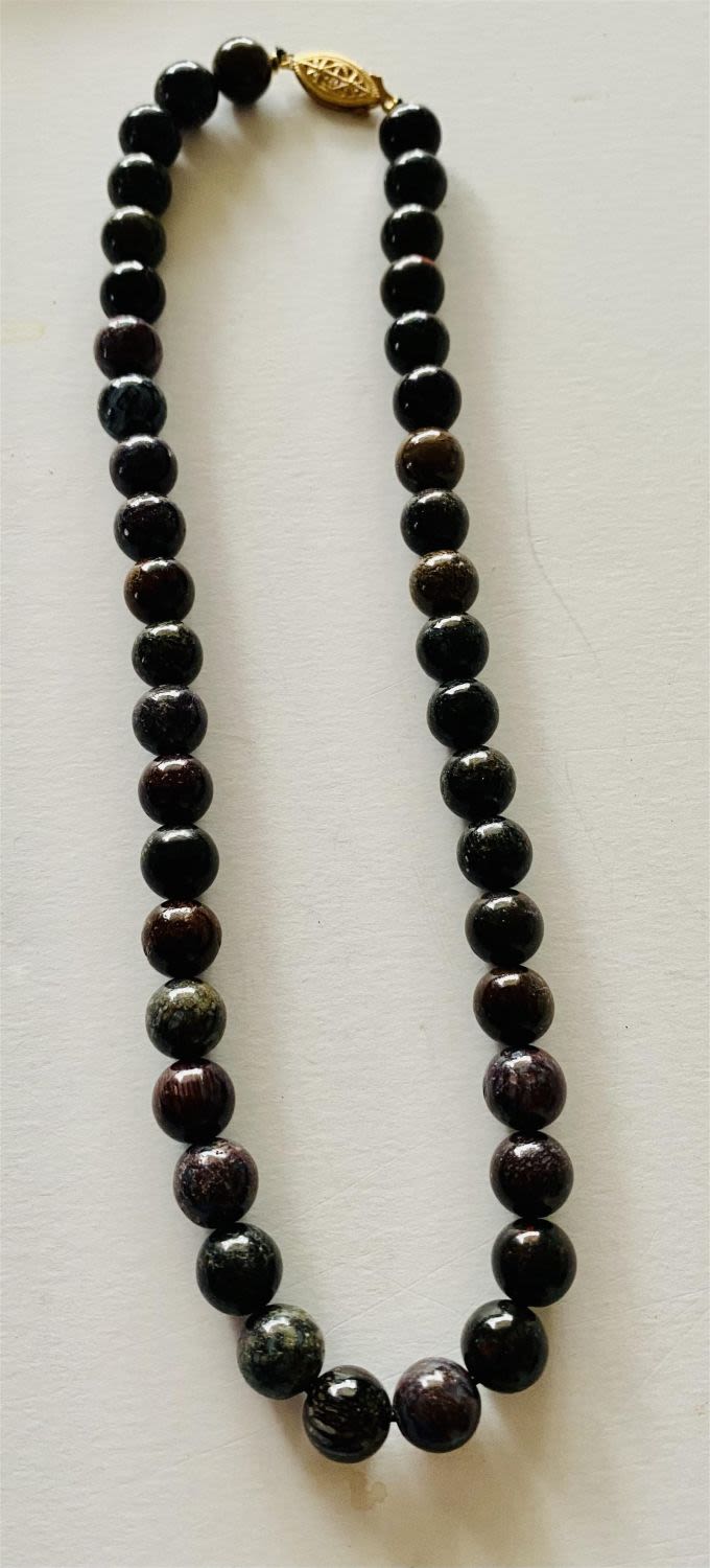 Lot 226: Dinosaur bone polished bead necklace