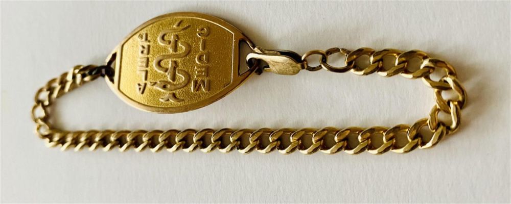Lot 236: Medic alert bracelet gold color