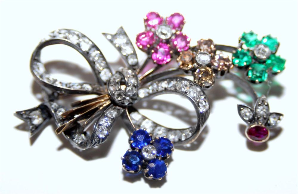 Lot 248: Ruby sapphire emerald gold pin