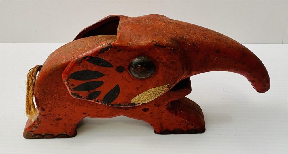 Lot 272: Metal antique red elephant trunk lifts