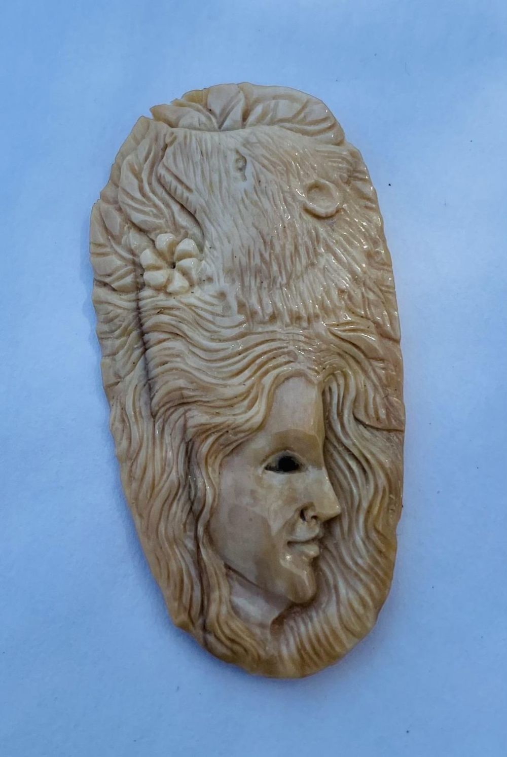 Lot 283: Carved bone lady /animal