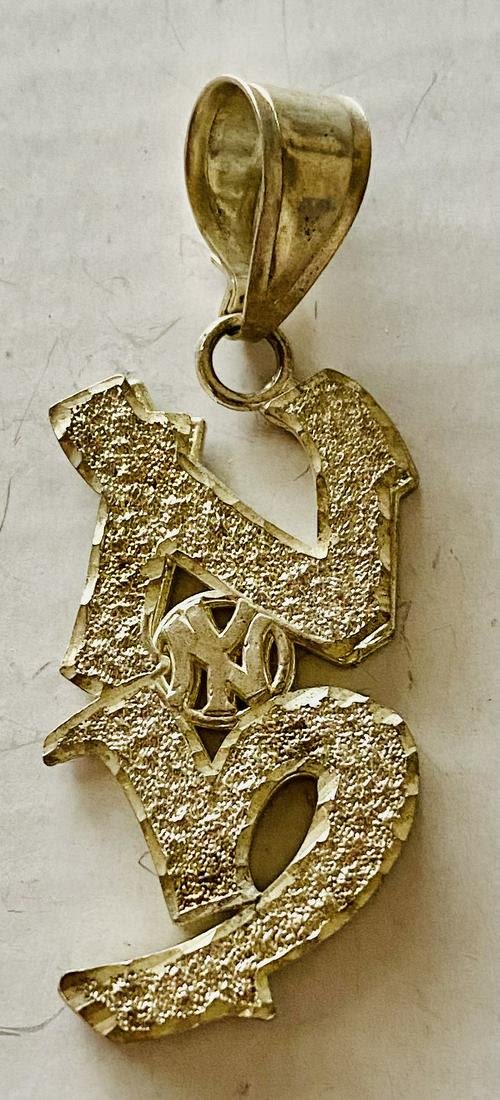 Lot 297: Sterling pendant NY Yankees