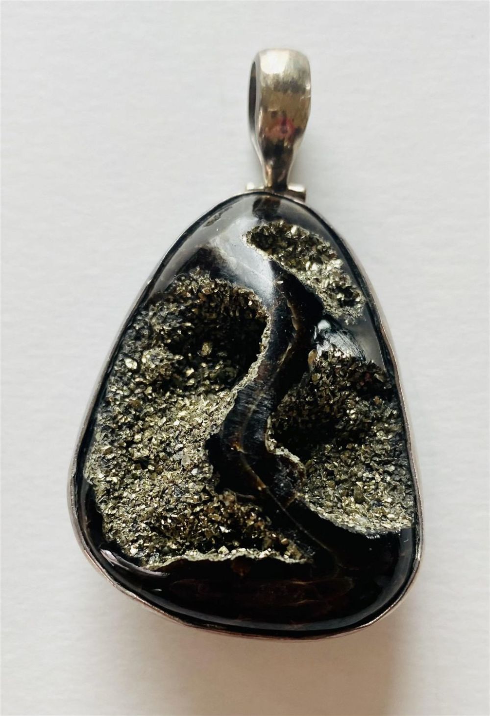 Lot 308: Ammonite pyritized sterling pendant reversible