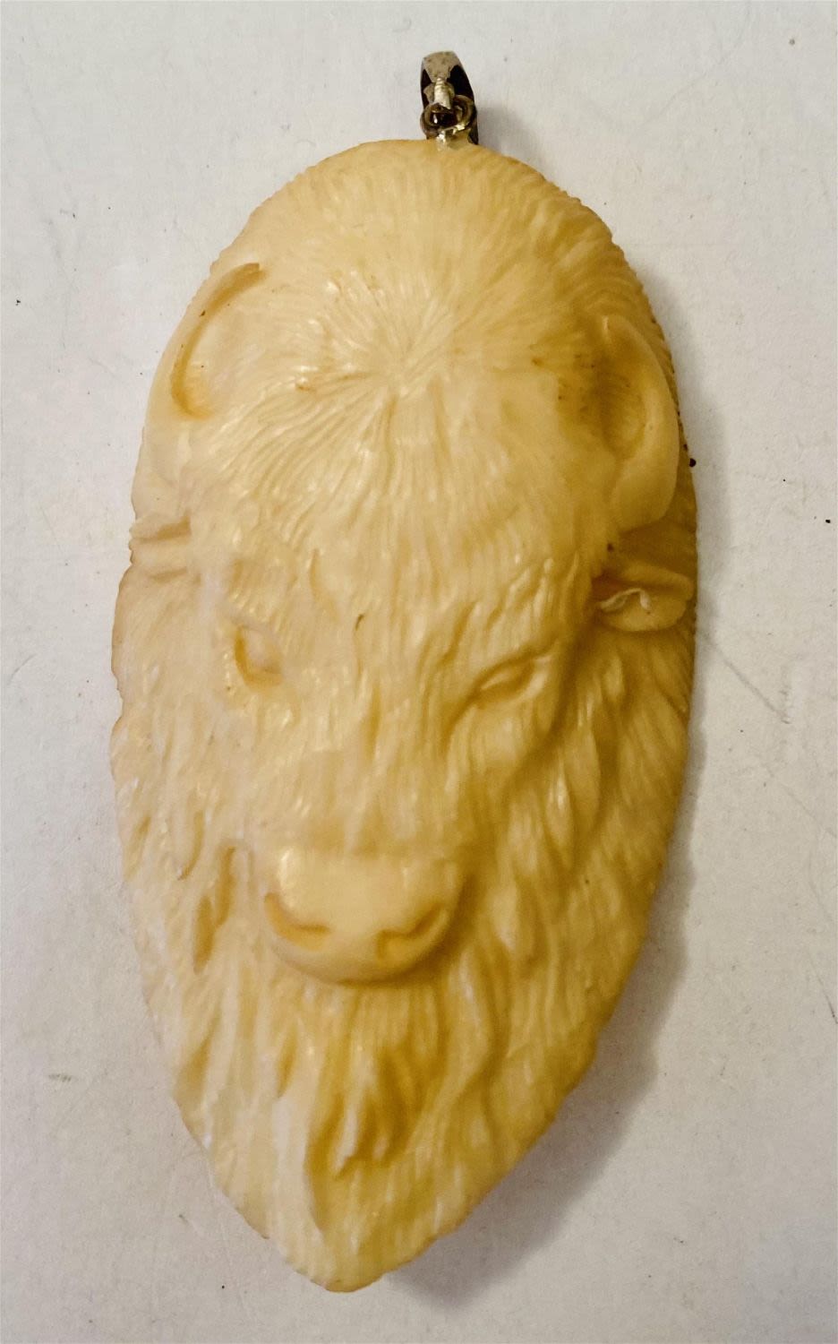 Lot 345: Bone buffalo carved pendant