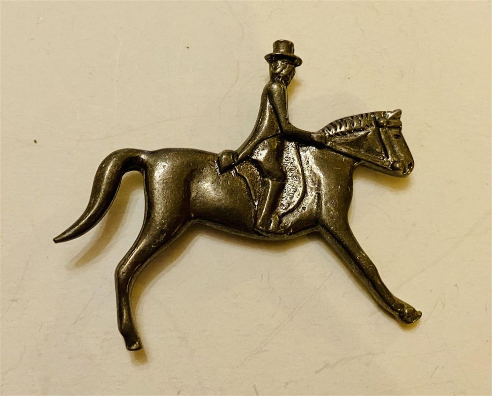 Lot 174: Equestrian horse rider pin