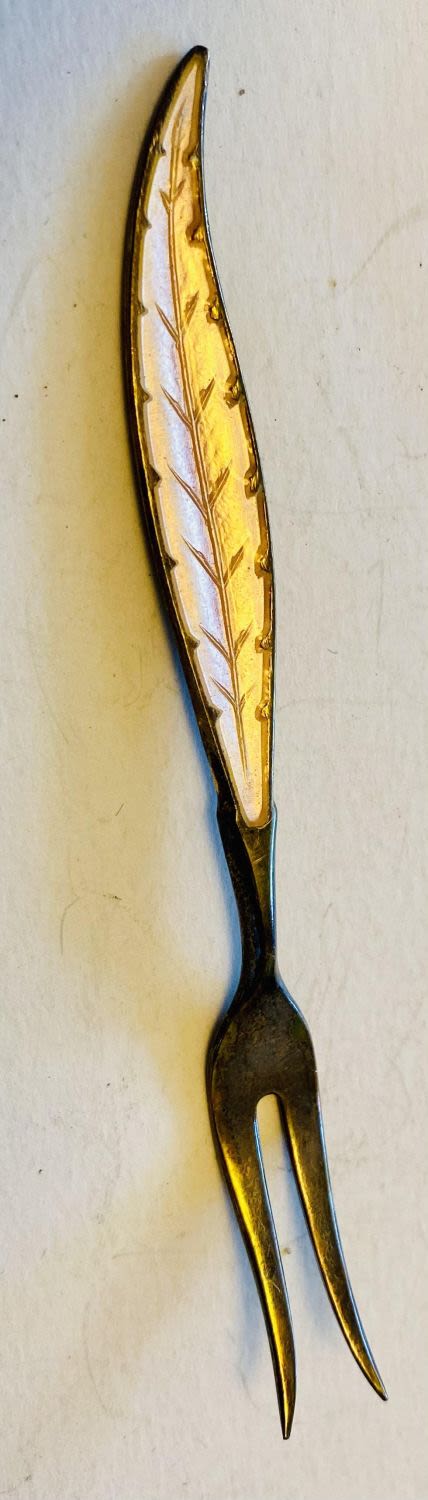 Lot 202: Enamel silver olive fork sterling