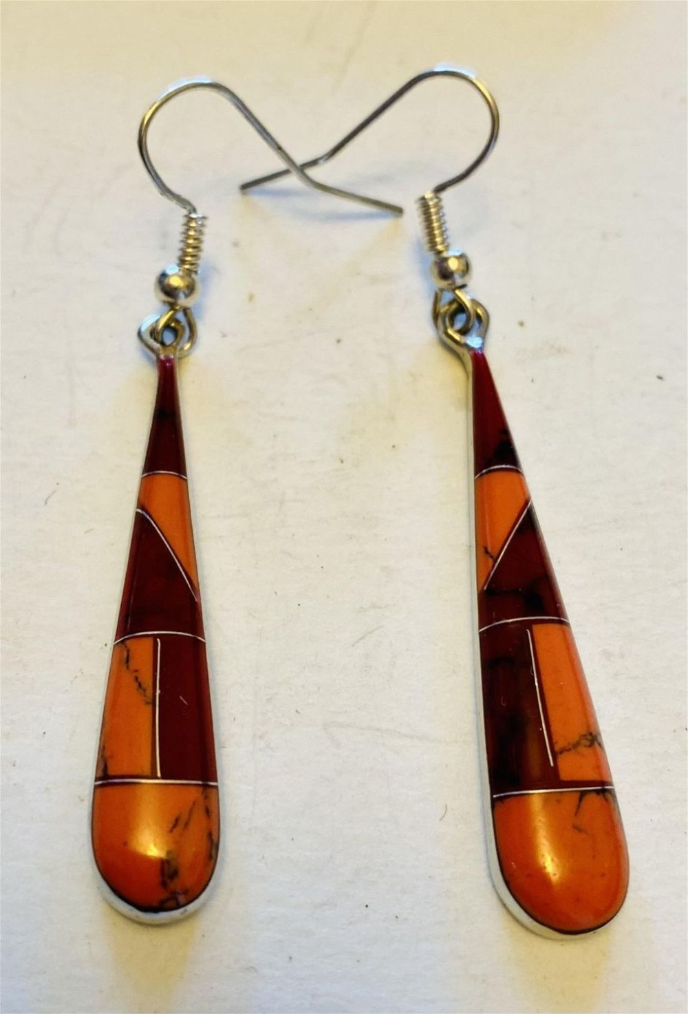 Lot 222: Inlaid earrings with geometric design