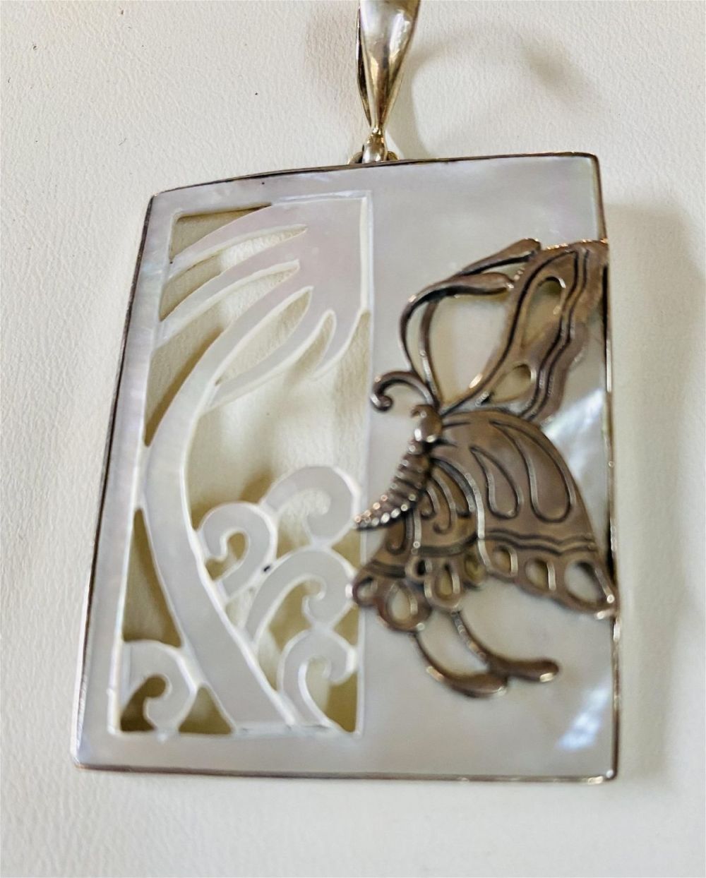 Lot 227: Mother of pearl butterfly sterling pendant