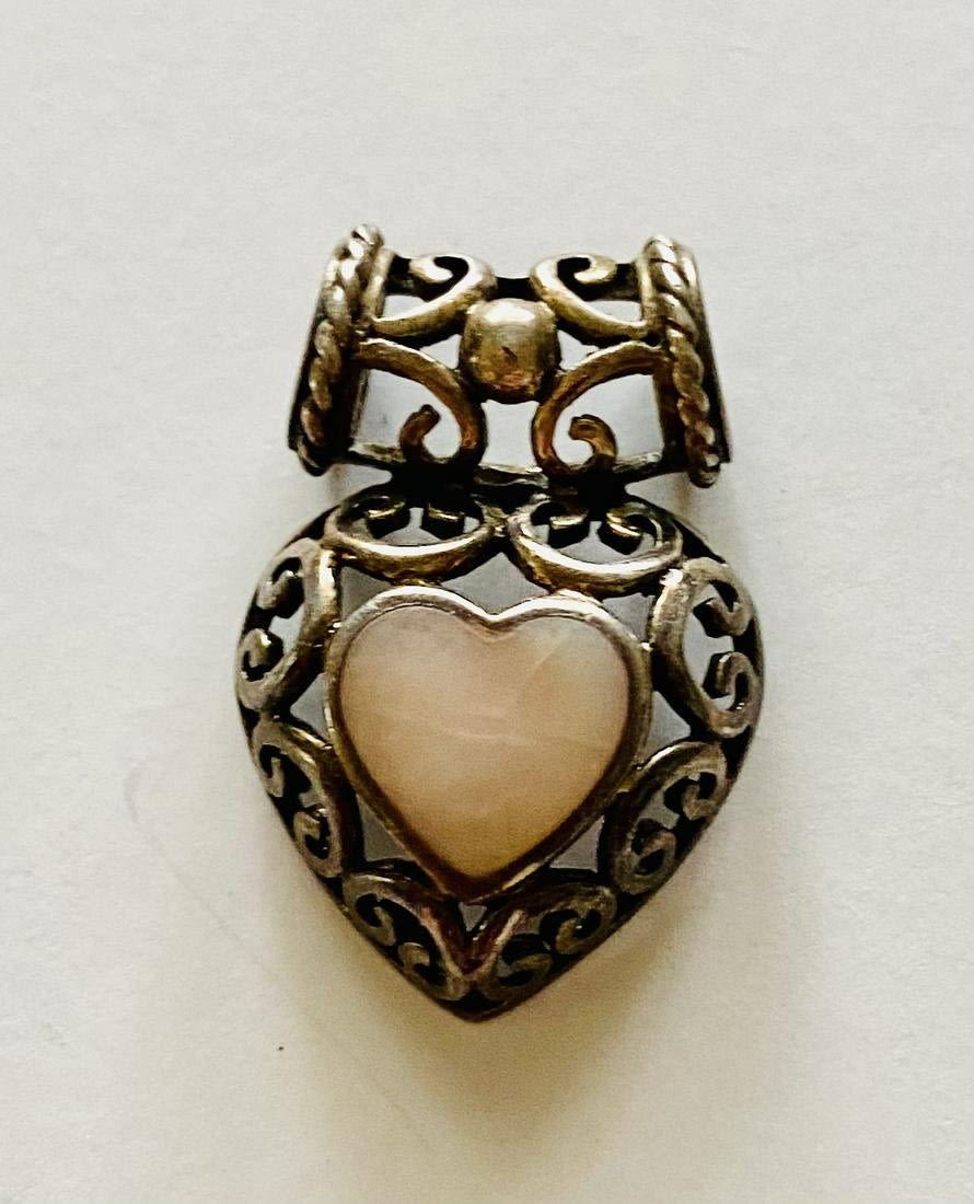 Lot 238: Sterling mother of pearl heart pendant