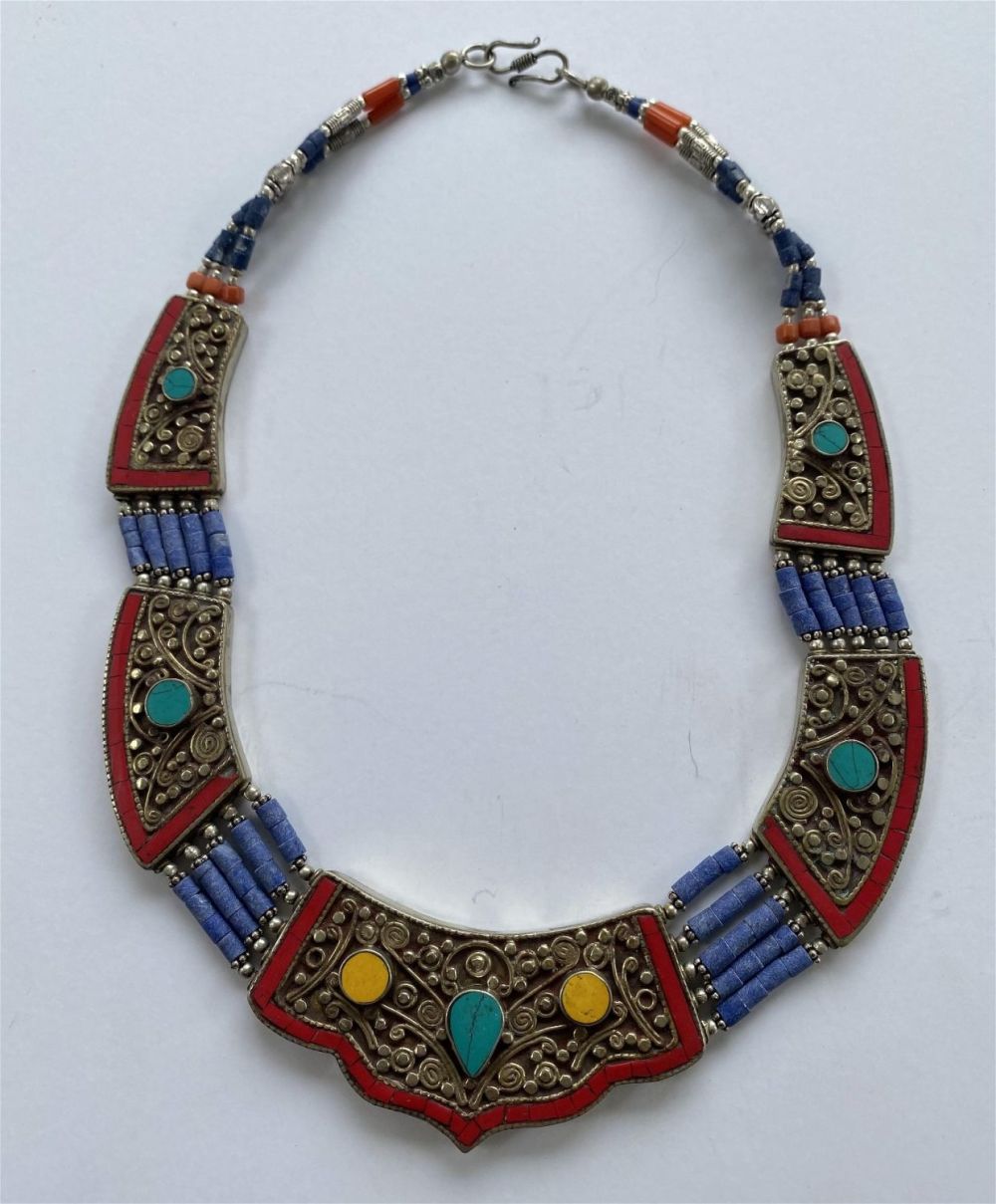 Lot 267: Tribal stone necklace - coral plus