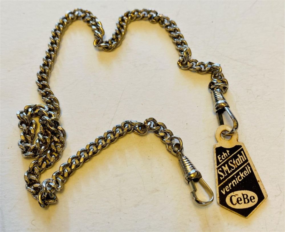 Lot 292: Old watch chain with original tag