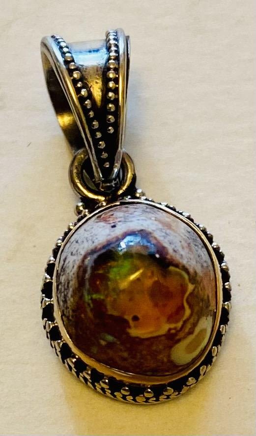 Lot 322: Sterling opal pendant brilliant color