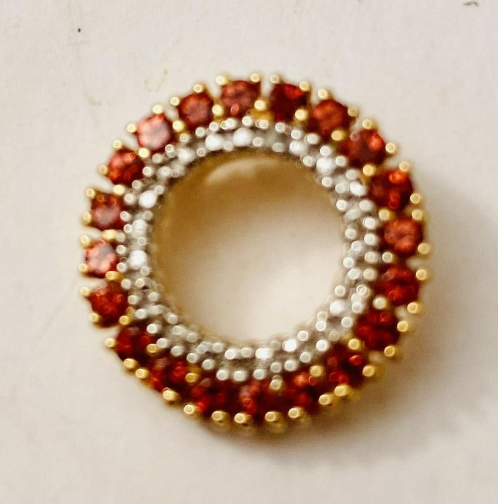 Lot 323: Ruby vermeil round pendant