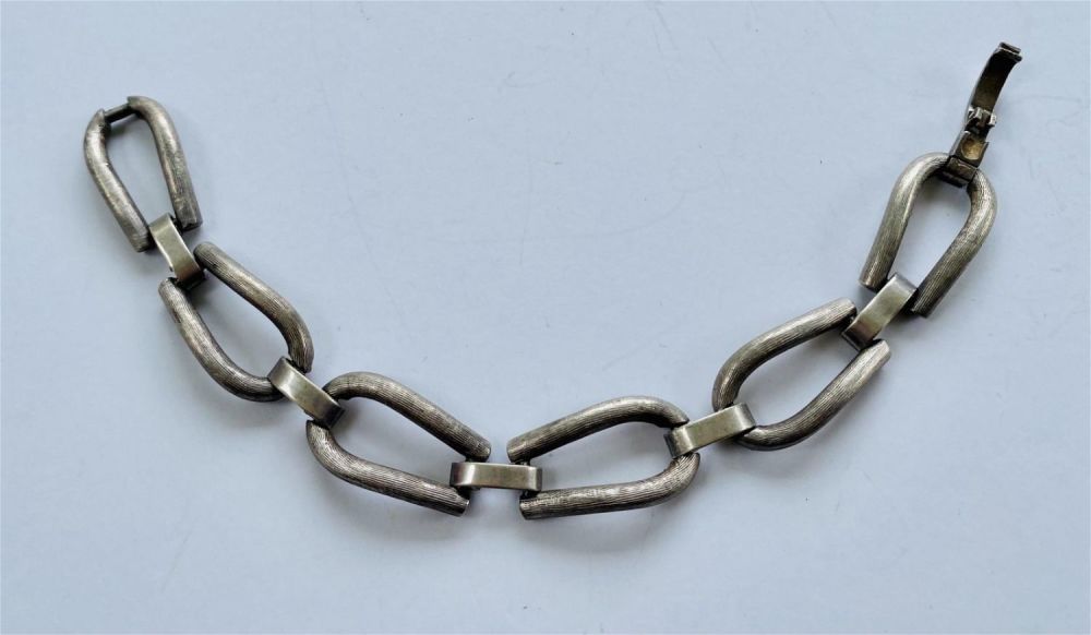Lot 337: Link silvertone bracelet