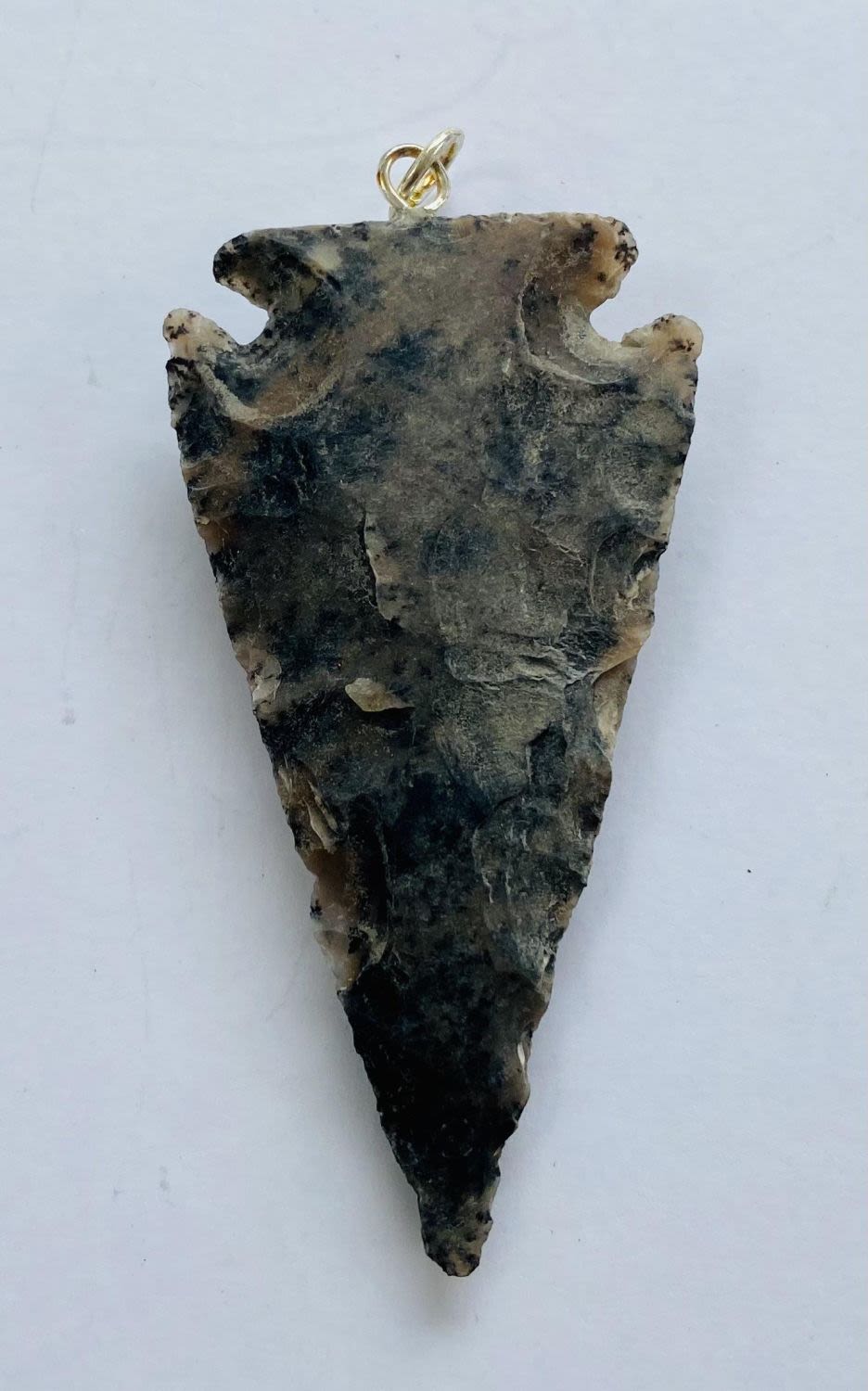 Lot 347: Arrowhead napped pendant stone