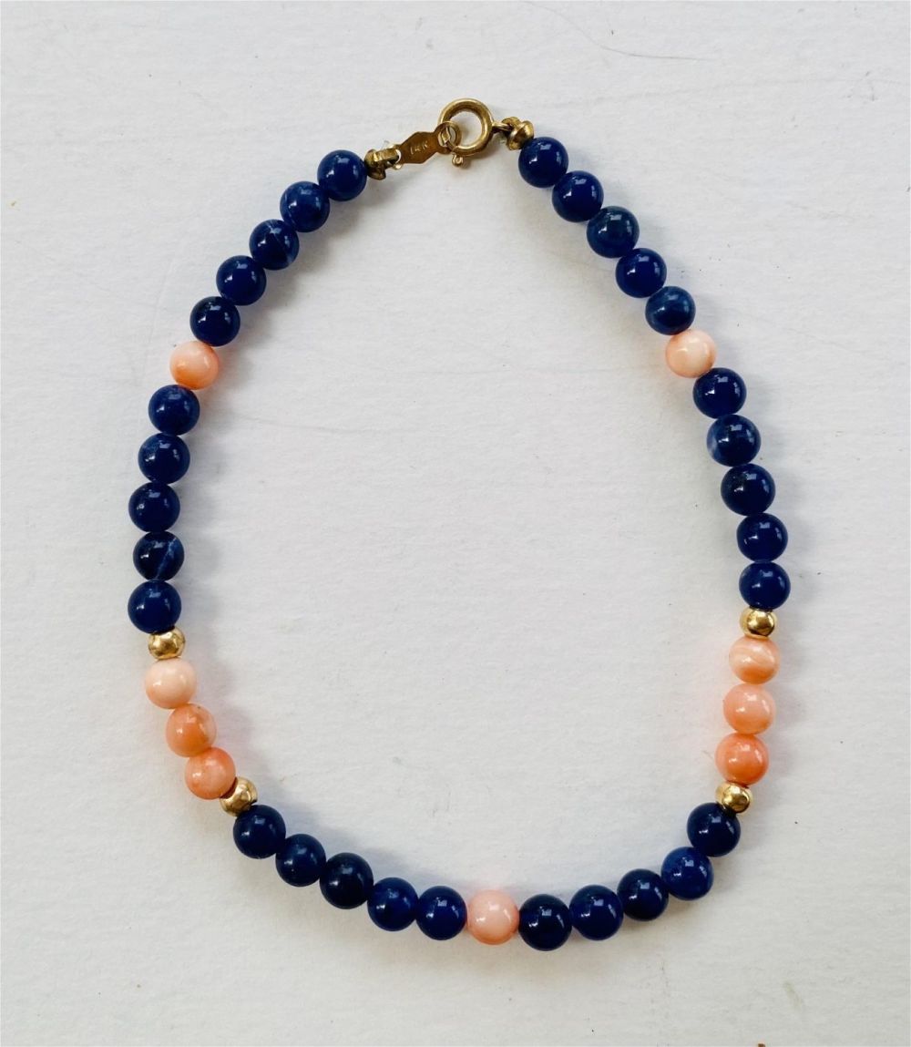 Lot 360: 14k coral gold onyx bead bracelet