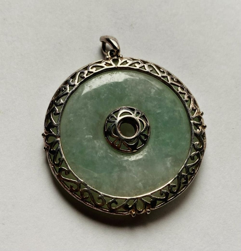 Lot 361: Jade circle of life pendant