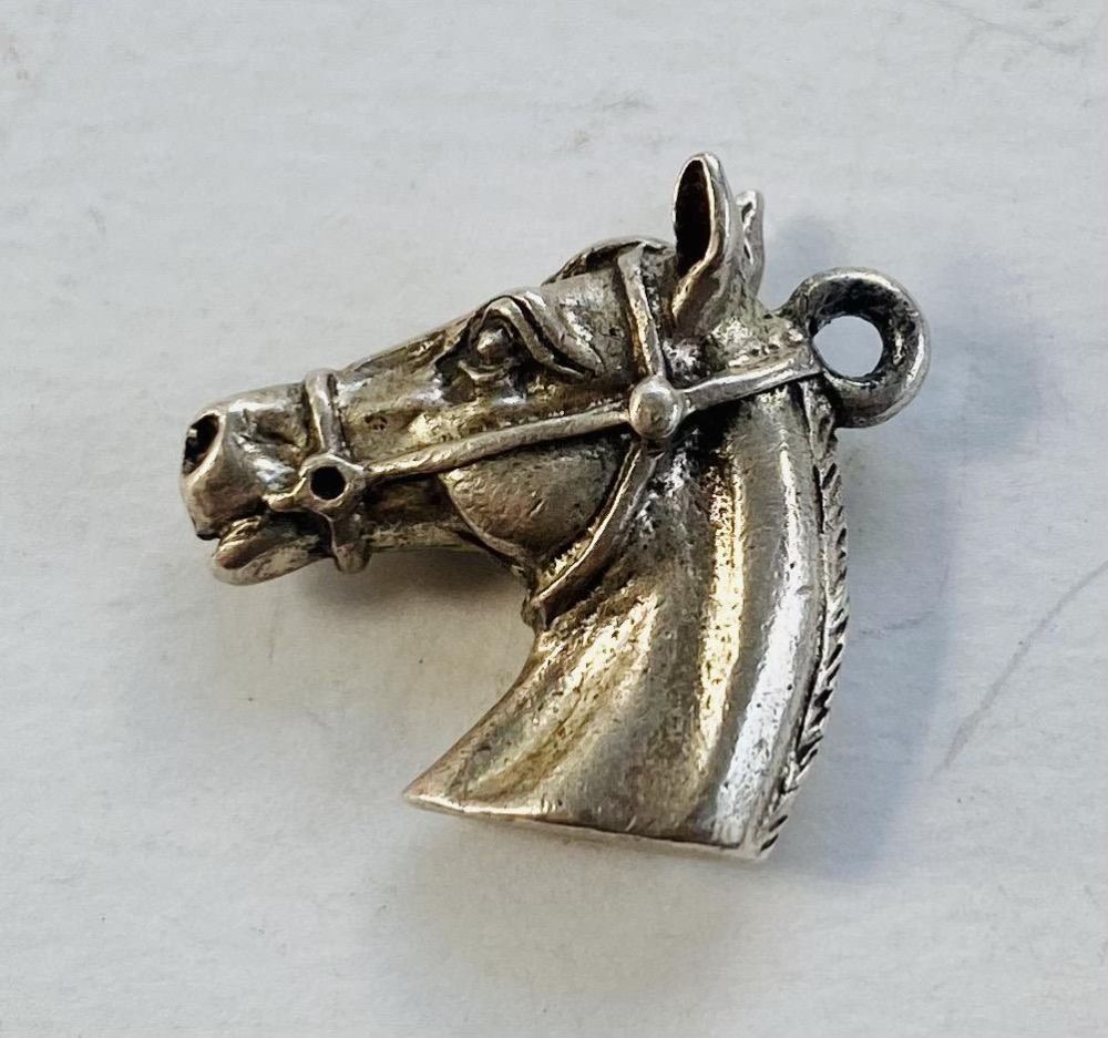 Lot 362: Horse head sterling charm - vintage
