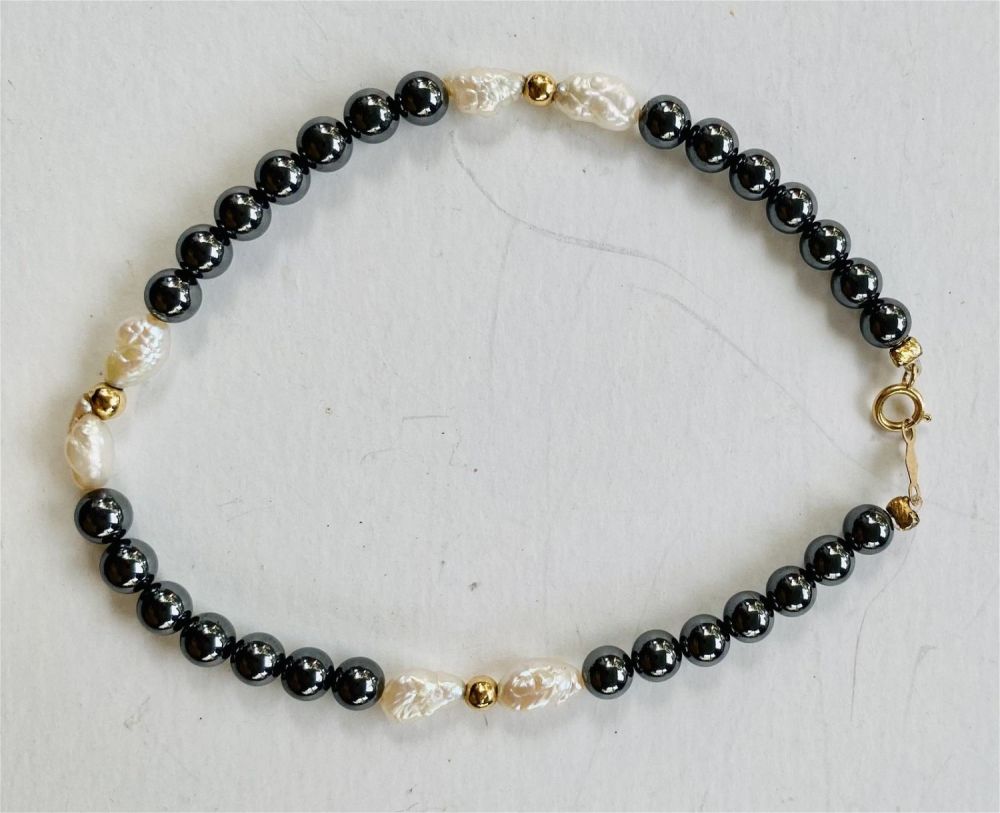 Lot 380: 14k hematite bead rice pearl bracelet
