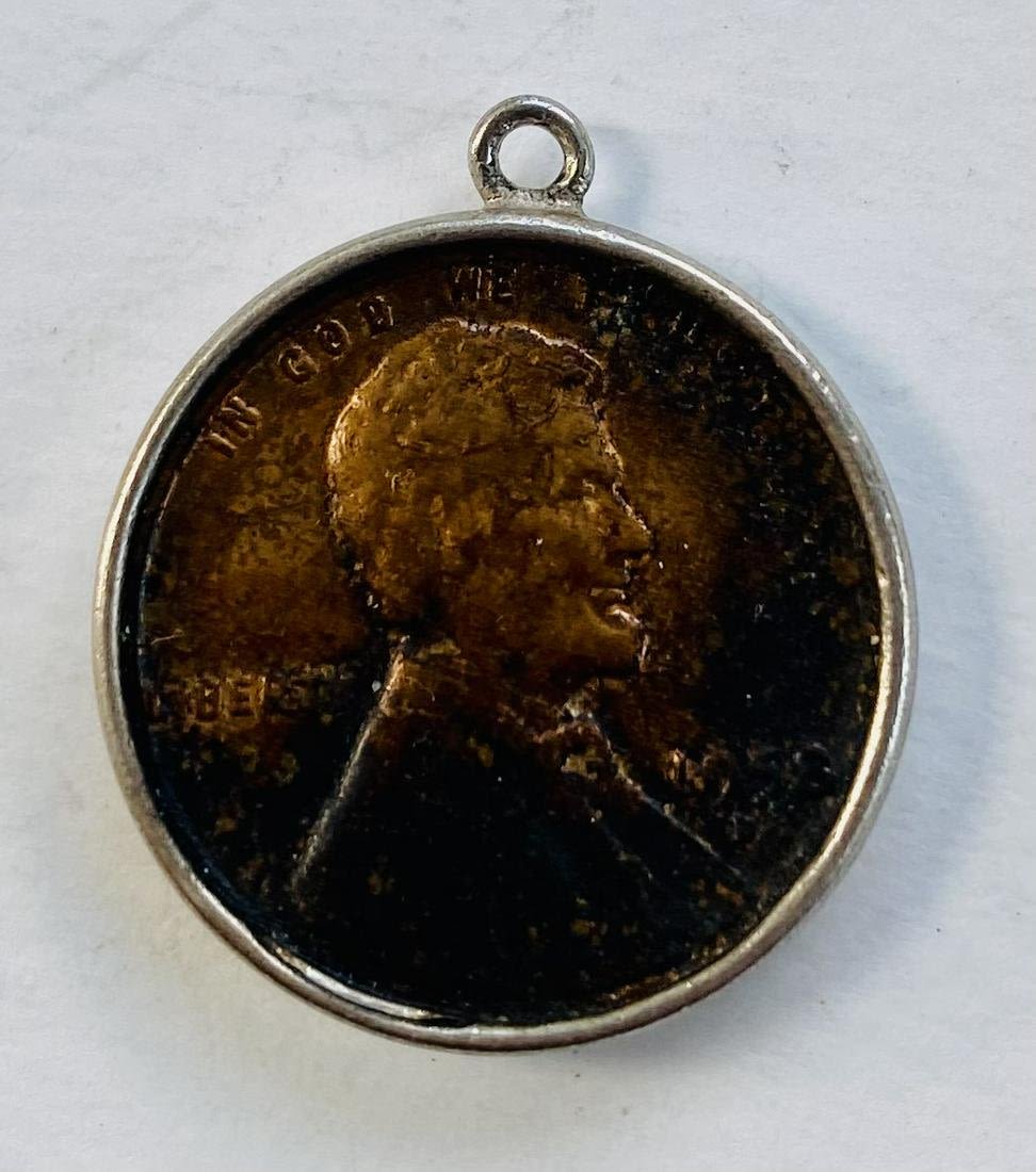 Lot 382: Lucky Penny charm with penny in holder