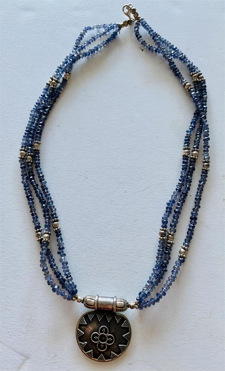 Lot 454: Tanzanite bead triple necklace/pendant