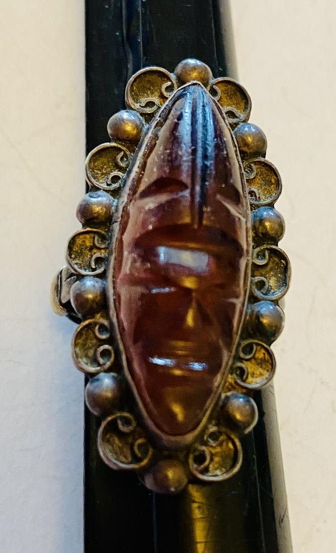 Lot 253: Deco mask sterling Mexican Amethyst ring