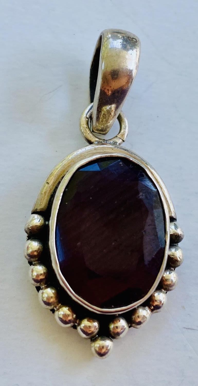 Lot 257: Ruby sterling pendant faceted