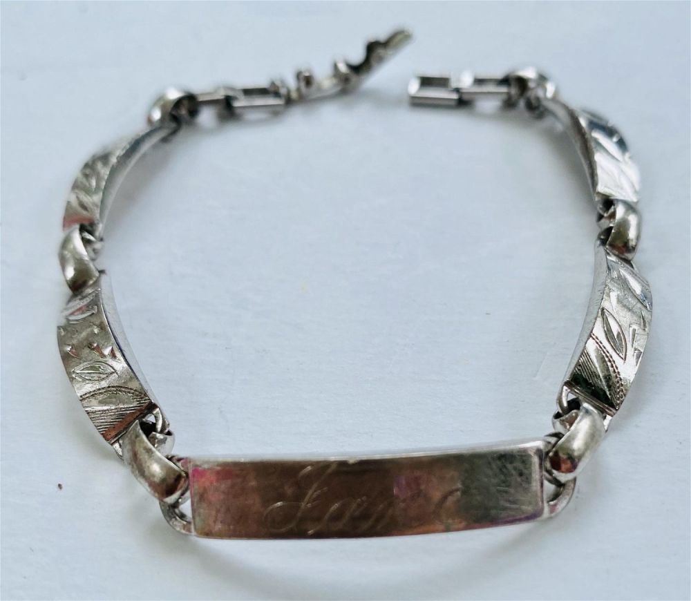 Lot 262: Sterling vintage ID bracelet engraved