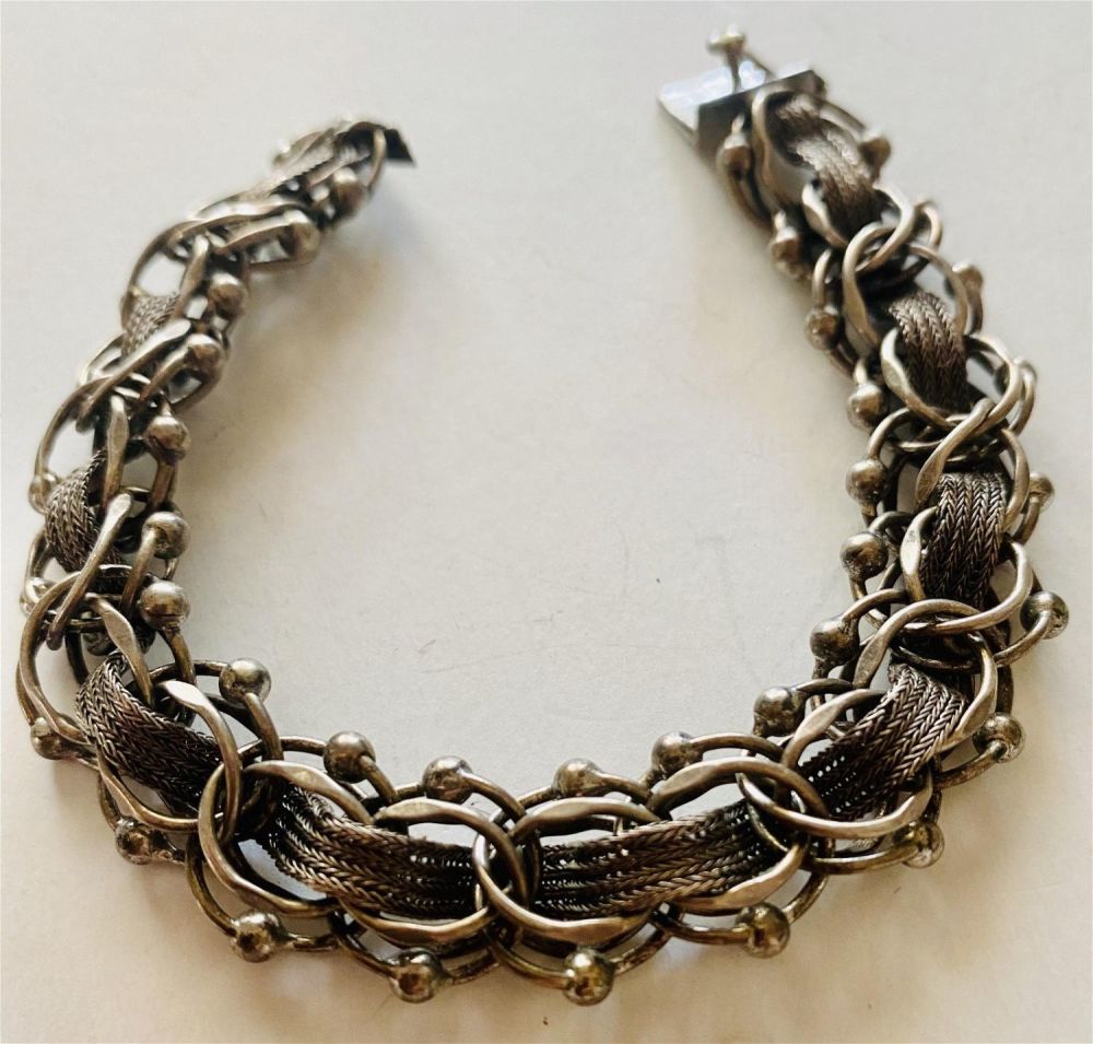 Lot 268: Sterling vintage charm bracelet