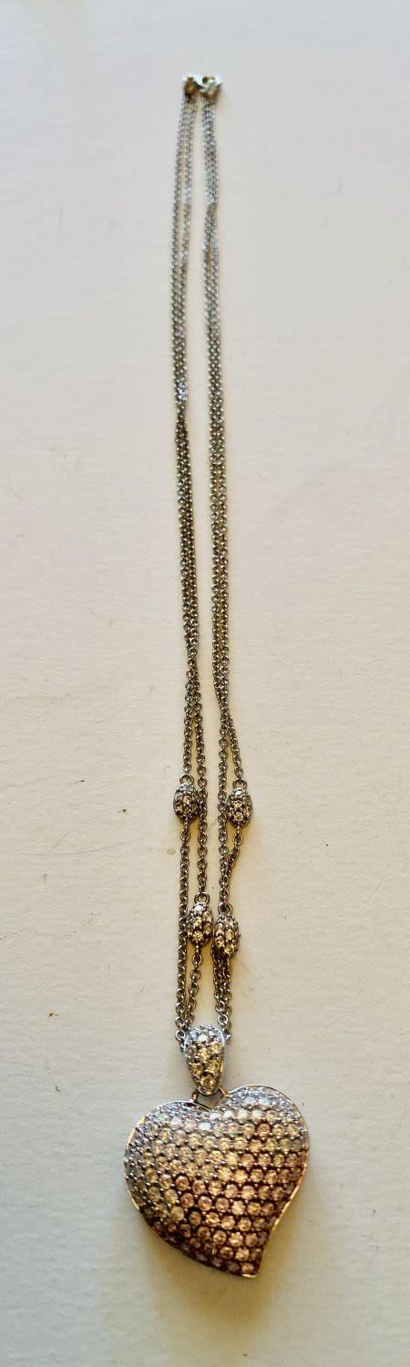 Lot 279: Heart silver necklace with stones