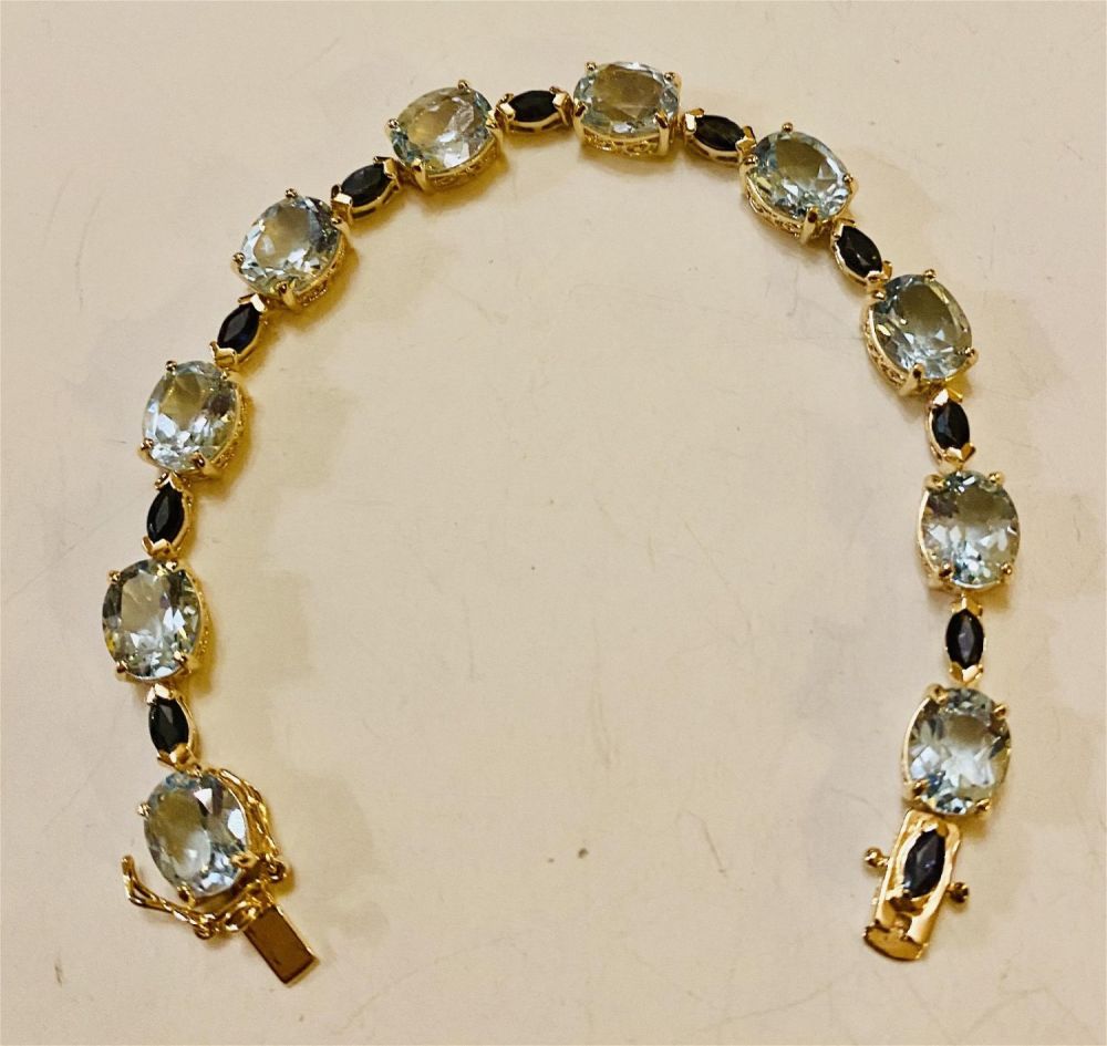 Lot 344: Vermeil blue topaz sapphire bracelet