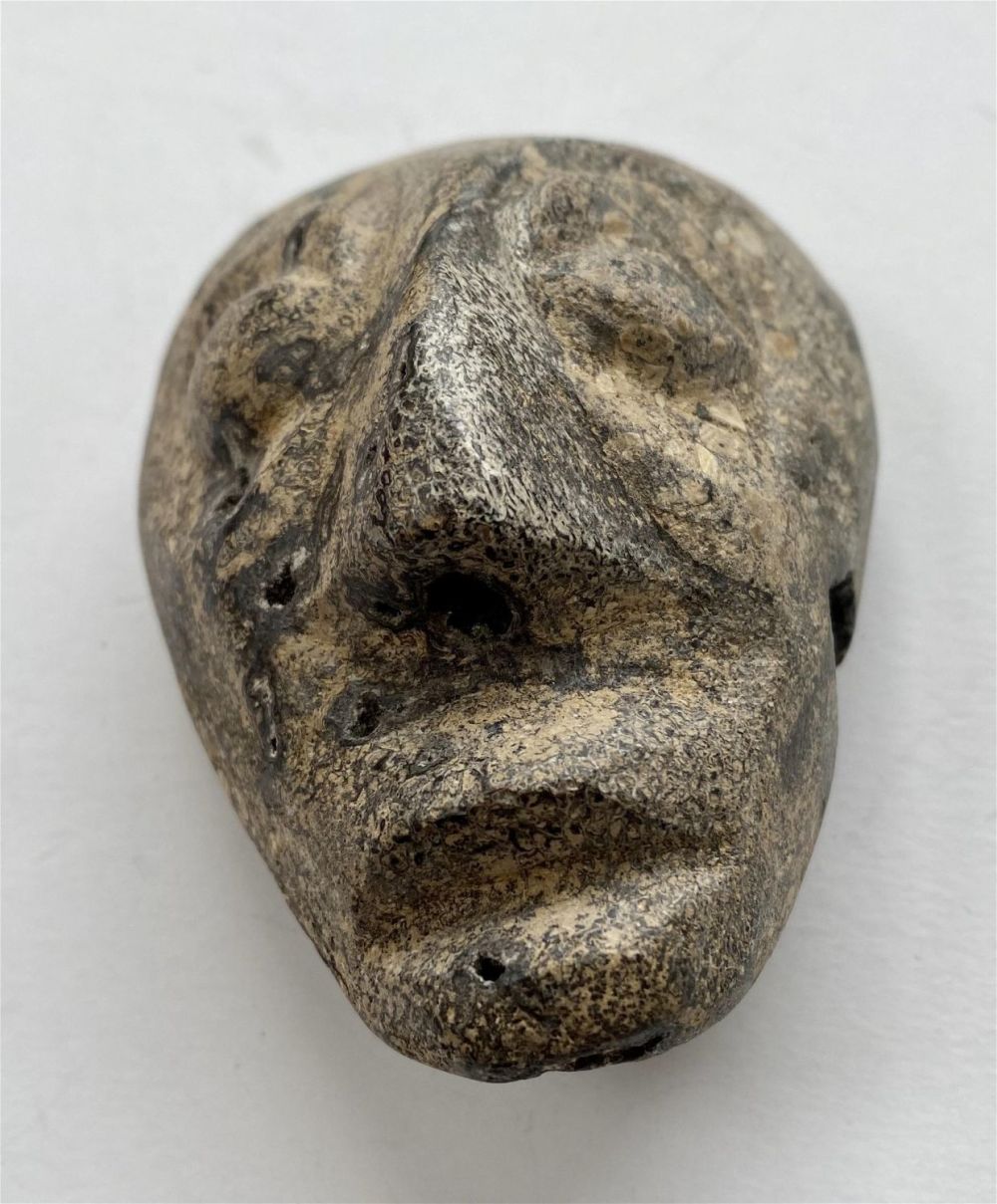 Lot 365: Mask prehistoric mammoth bone Java