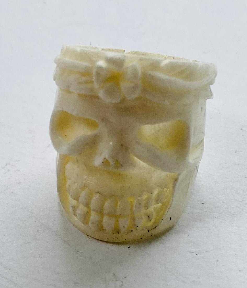 Lot 372: Bone carved skull ring