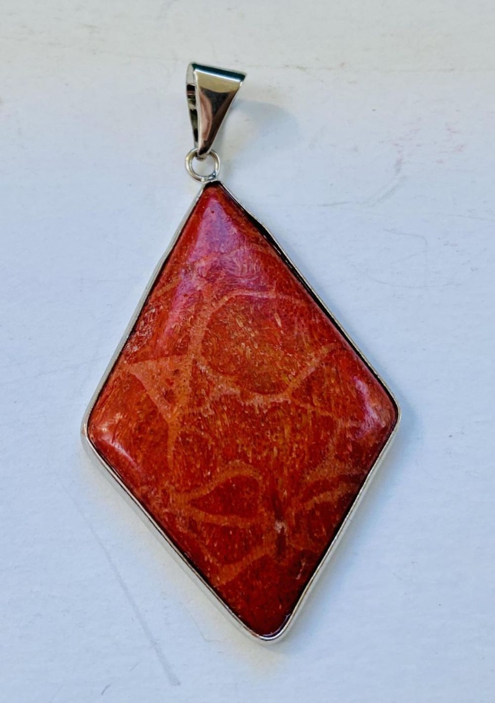 Lot 439: Coral diamond shape pendant