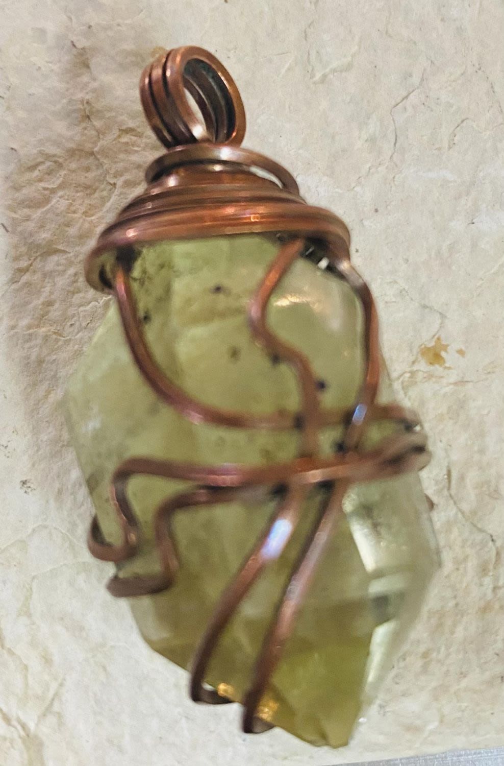 Lot 496: Citrine specimen pendant- wire wrapped in copper