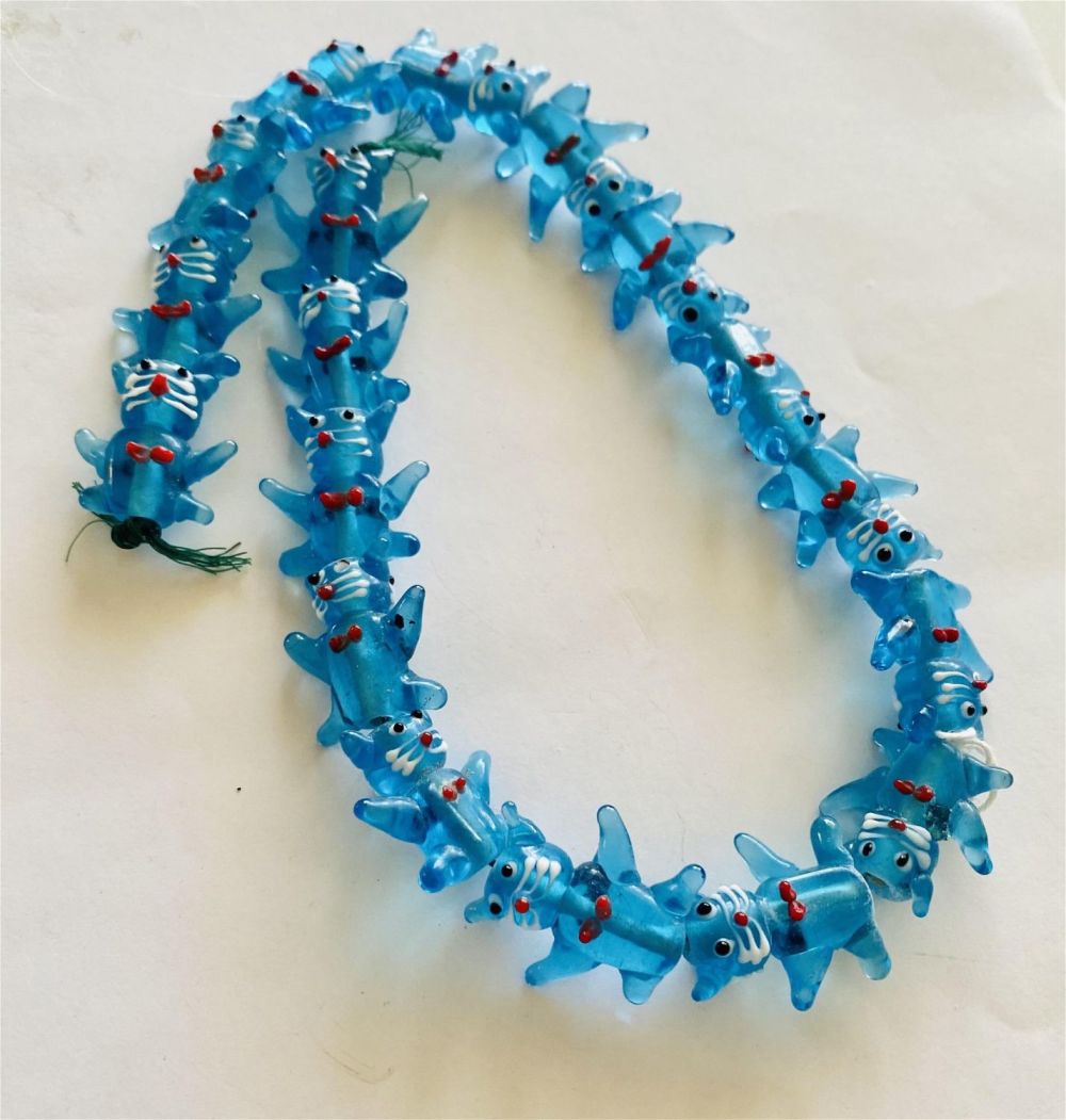 Lot 497: Blue glass hand blown cat beads