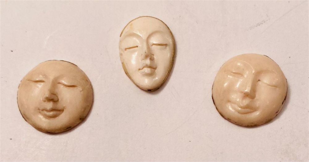 Lot 246: 3 hand carved bone faces