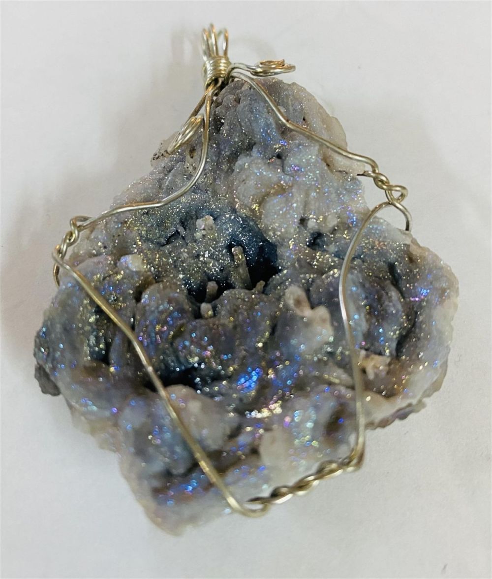Lot 284: Druzy calcite wire wrapped pendant