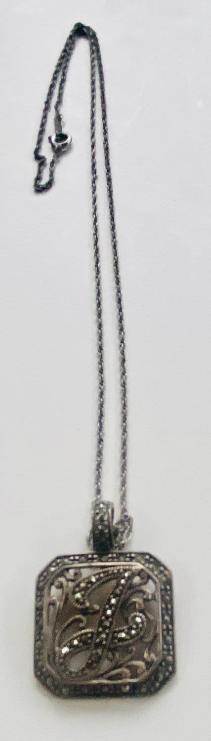 Lot 94: Marcasite sterling necklace initials