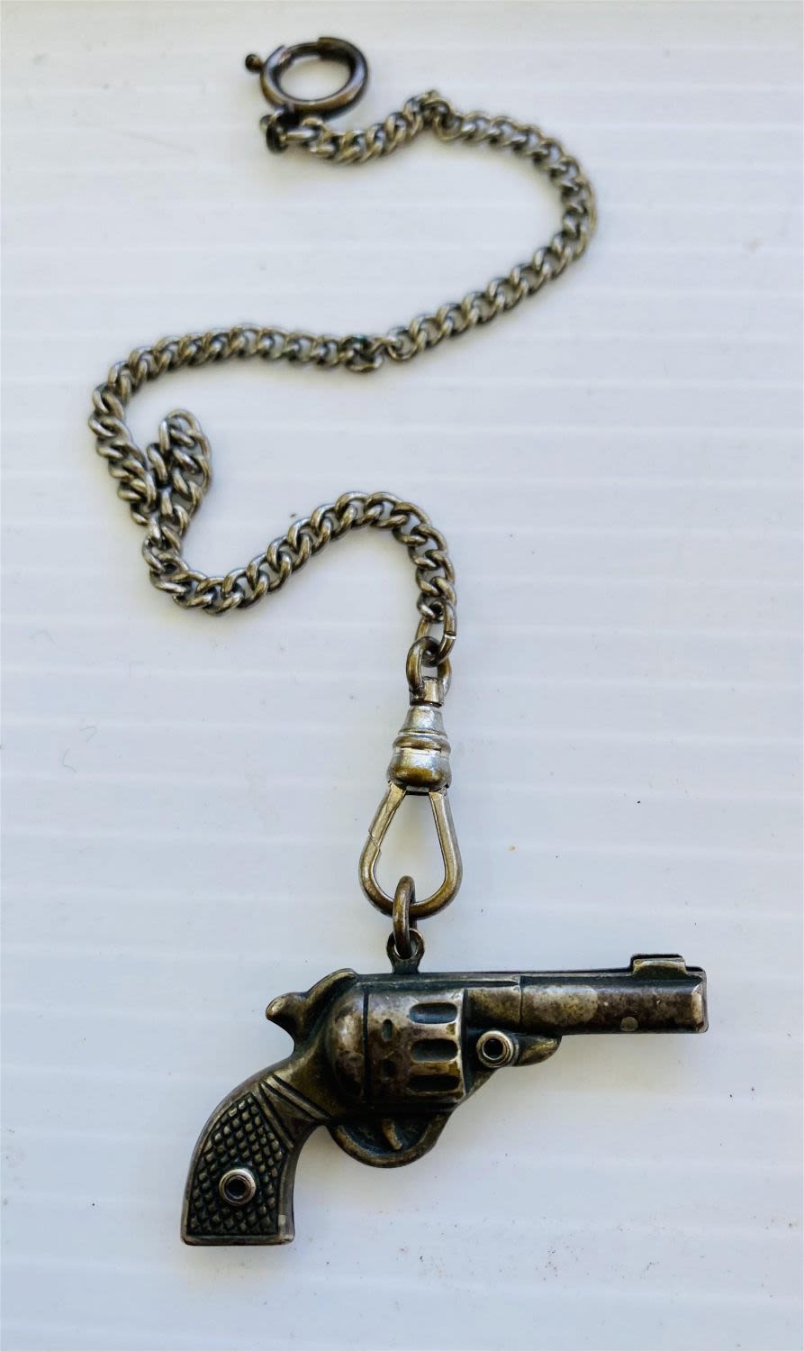 Lot 308: Pistol fob watch chain vintage