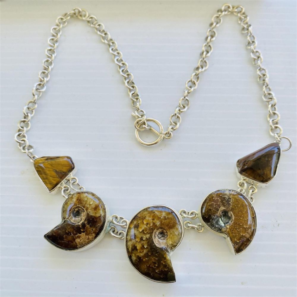 Lot 311: Sterling ammonite necklace fossil