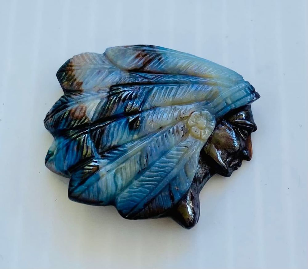 Lot 397: Opal carved Indian Chief with headdress