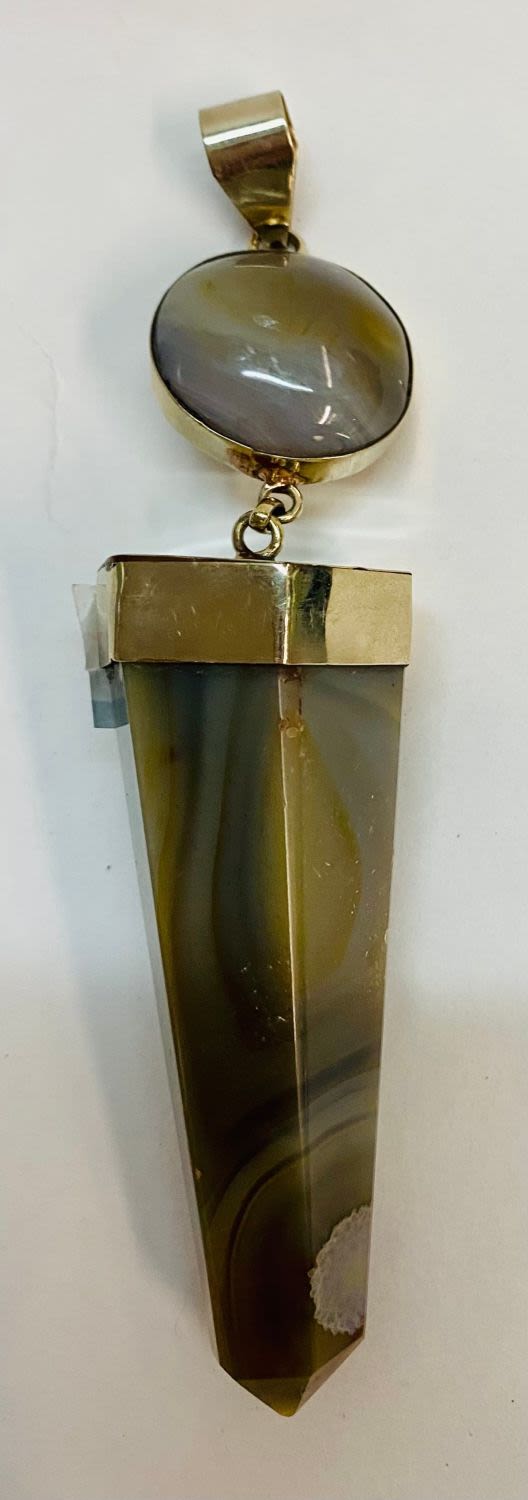 Lot 383: Large polished pendant - double
