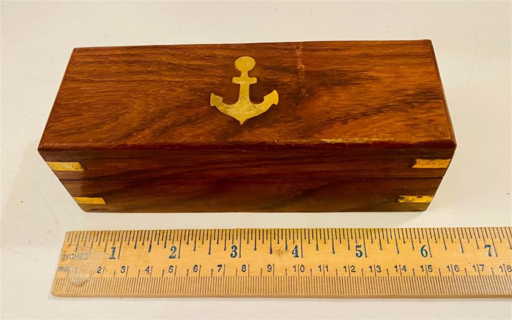 Lot 81: Nautical inlaid box /anchor in brass