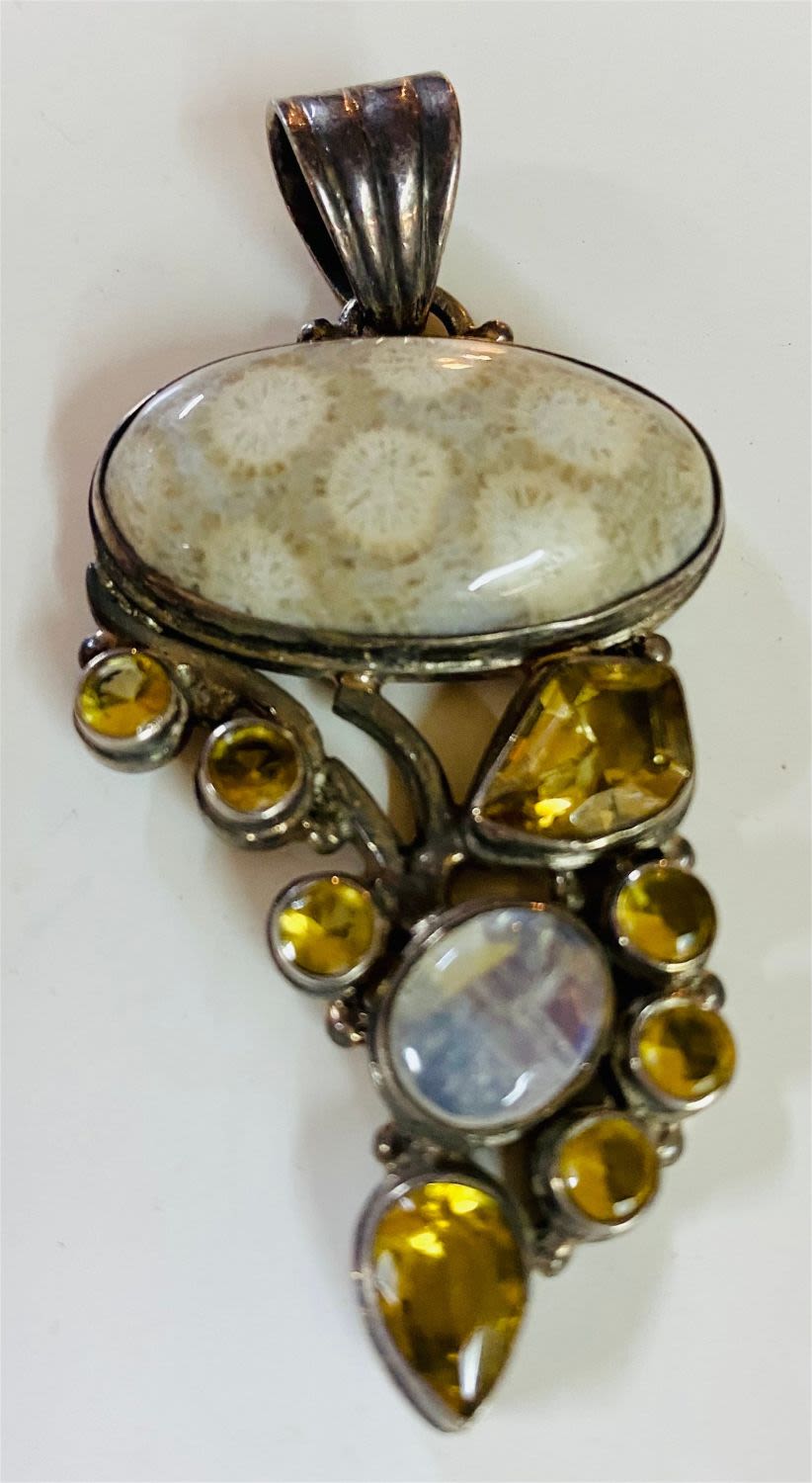 Lot 289: Fancy sterling gemstone coral pendant