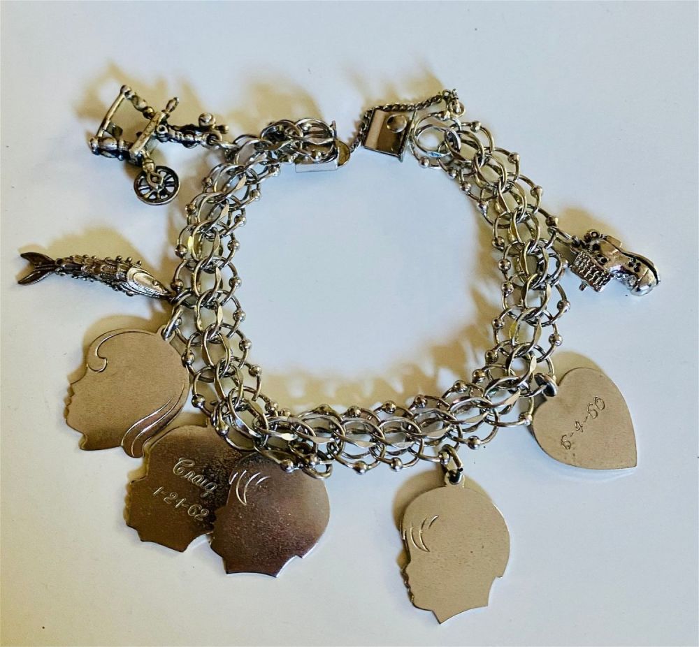 Lot 497: Charm bracelet link with charms